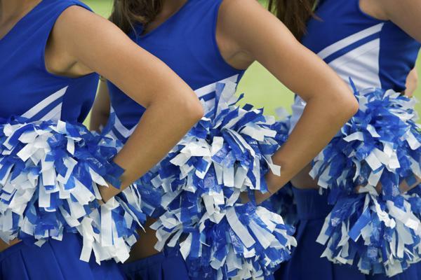 Cheerleaders holding pom-poms