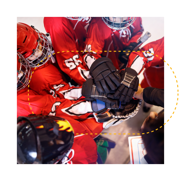 Hockey team in huddle with coach