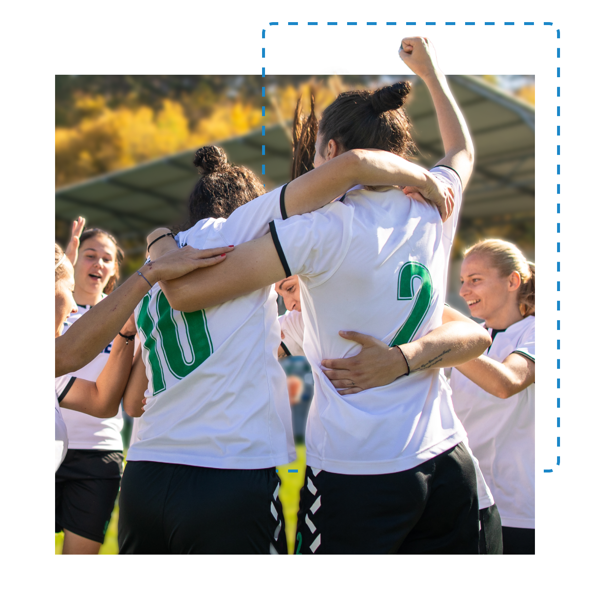 A group of celebrating female soccer players